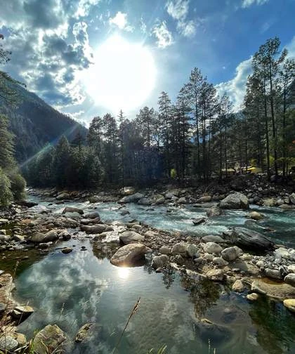 Sun over a mountain stream