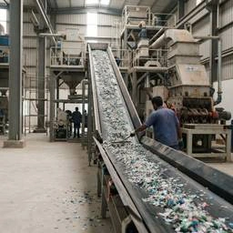 A plastic recycling plant with a conveyor line